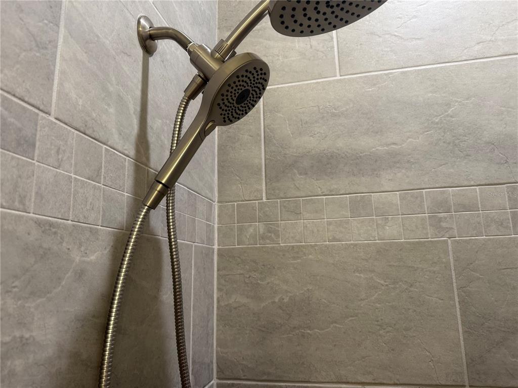 15467 Maynard Avenue Port Charlotte, FL 33953 - Photo 12 of 13 a bathroom with a shower