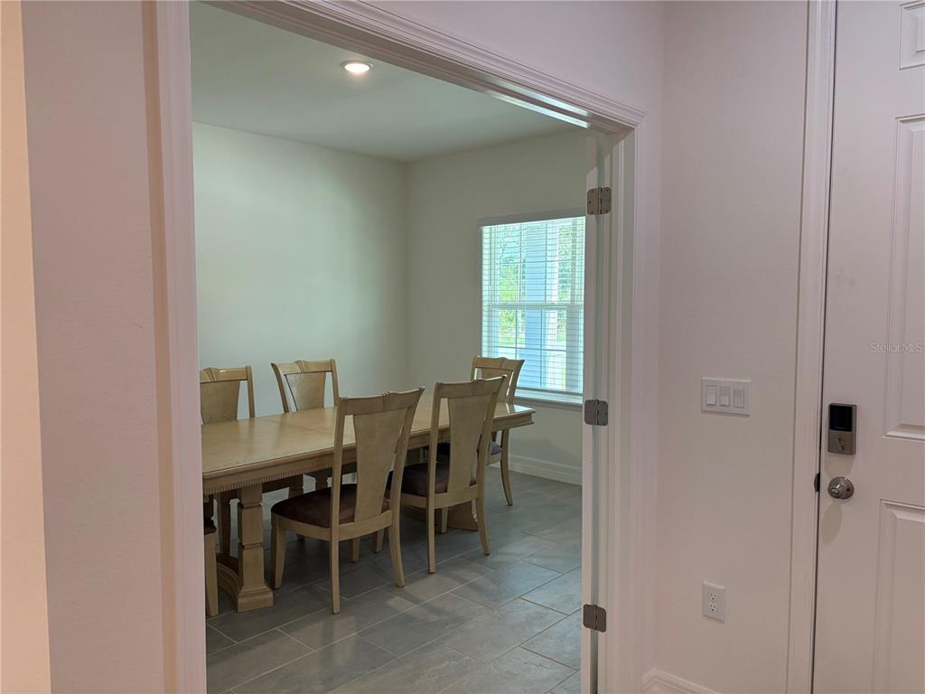 15467 Maynard Avenue Port Charlotte, FL 33953 - Photo 5 of 13 a view of a dining room with furniture