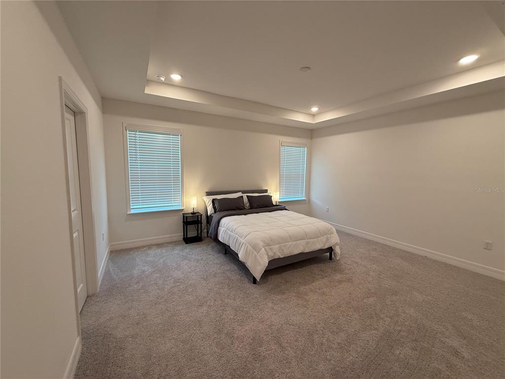 15467 Maynard Avenue Port Charlotte, FL 33953 - Photo 7 of 13 a bedroom with a bed and a window