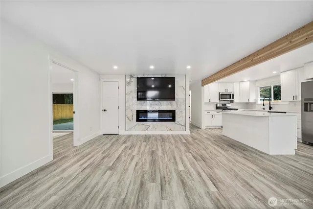 a view of kitchen and wooden floor