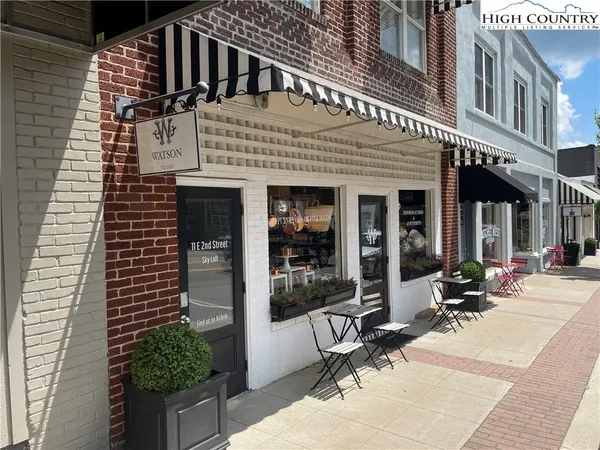 a view of a building with sitting area