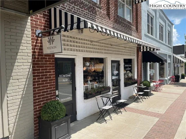 a view of a building with sitting area