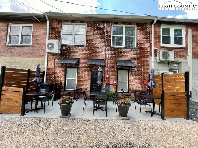 a view of a chairs and table in the patio