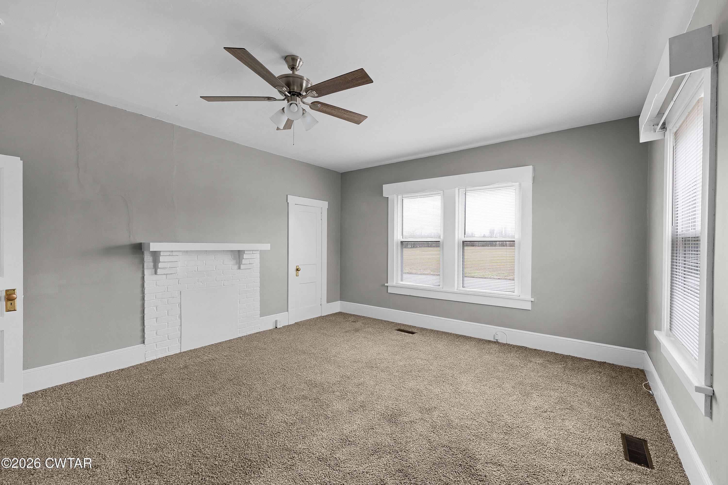 2 Gregg Street Jackson, TN 38301 - Photo 11 of 18 a view of a livingroom with a ceiling fan and window
