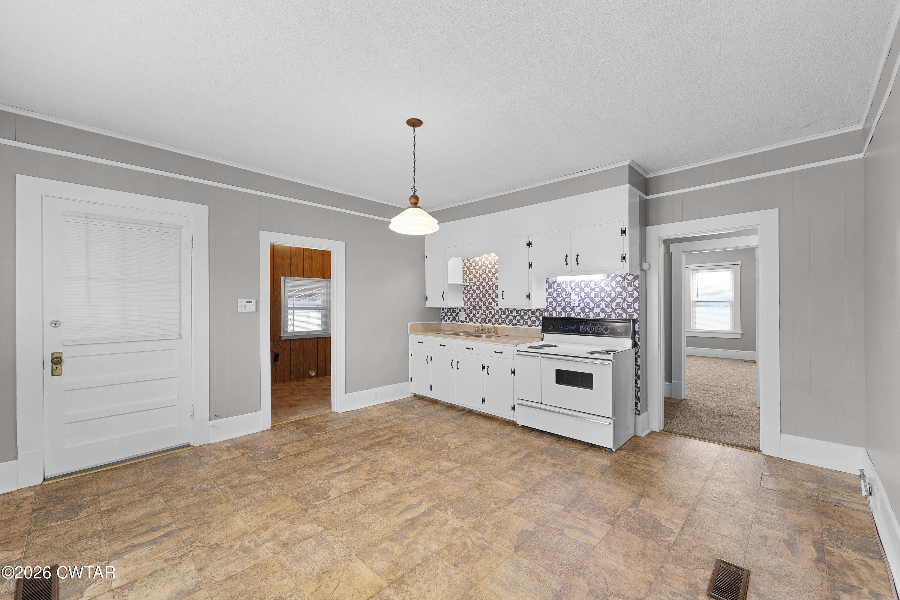 2 Gregg Street Jackson, TN 38301 - Photo 16 of 18 a kitchen with stainless steel appliances a stove top oven and cabinets