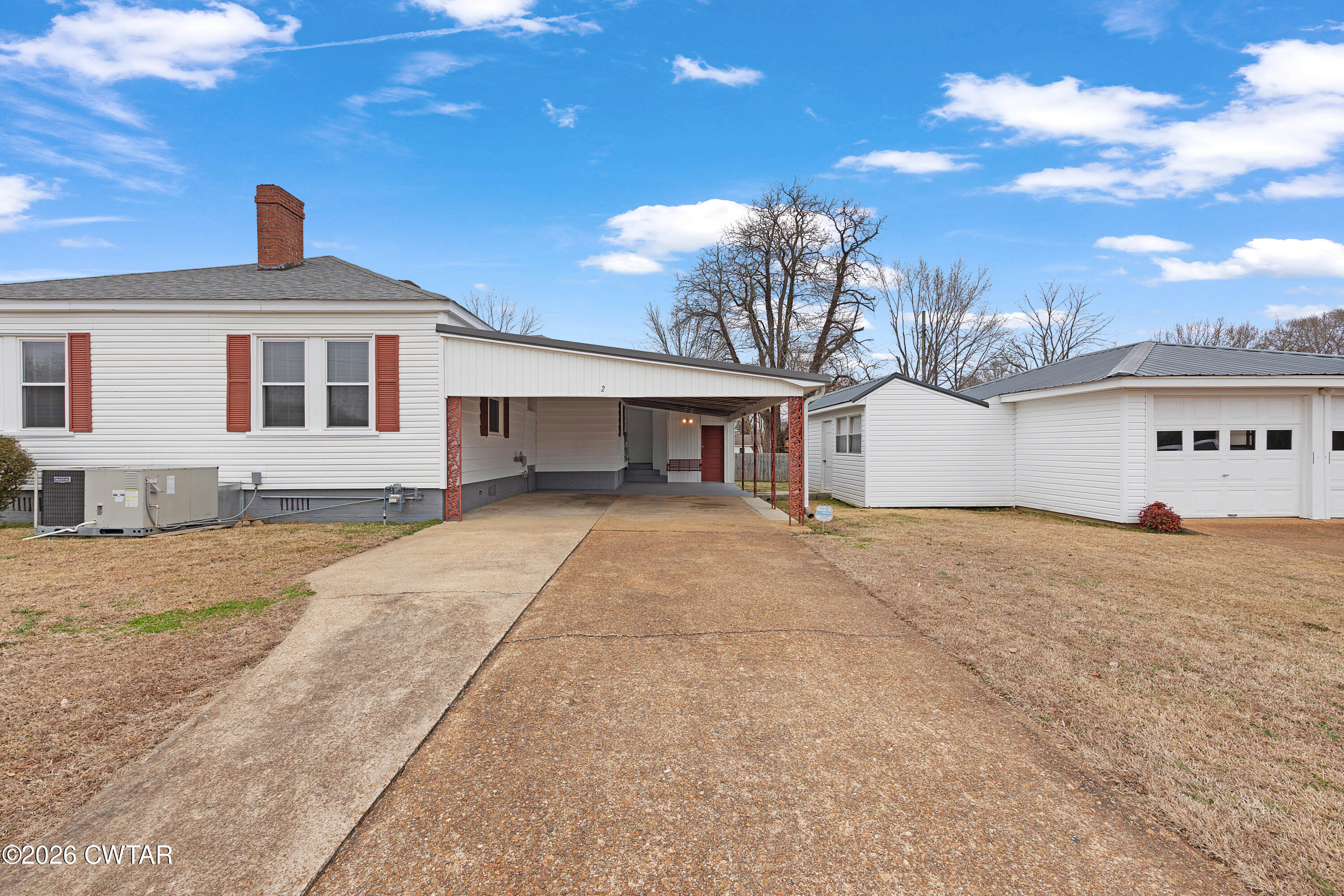 2 Gregg Street Jackson, TN 38301 - Photo 3 of 18 a front view of a house with a yard and garage