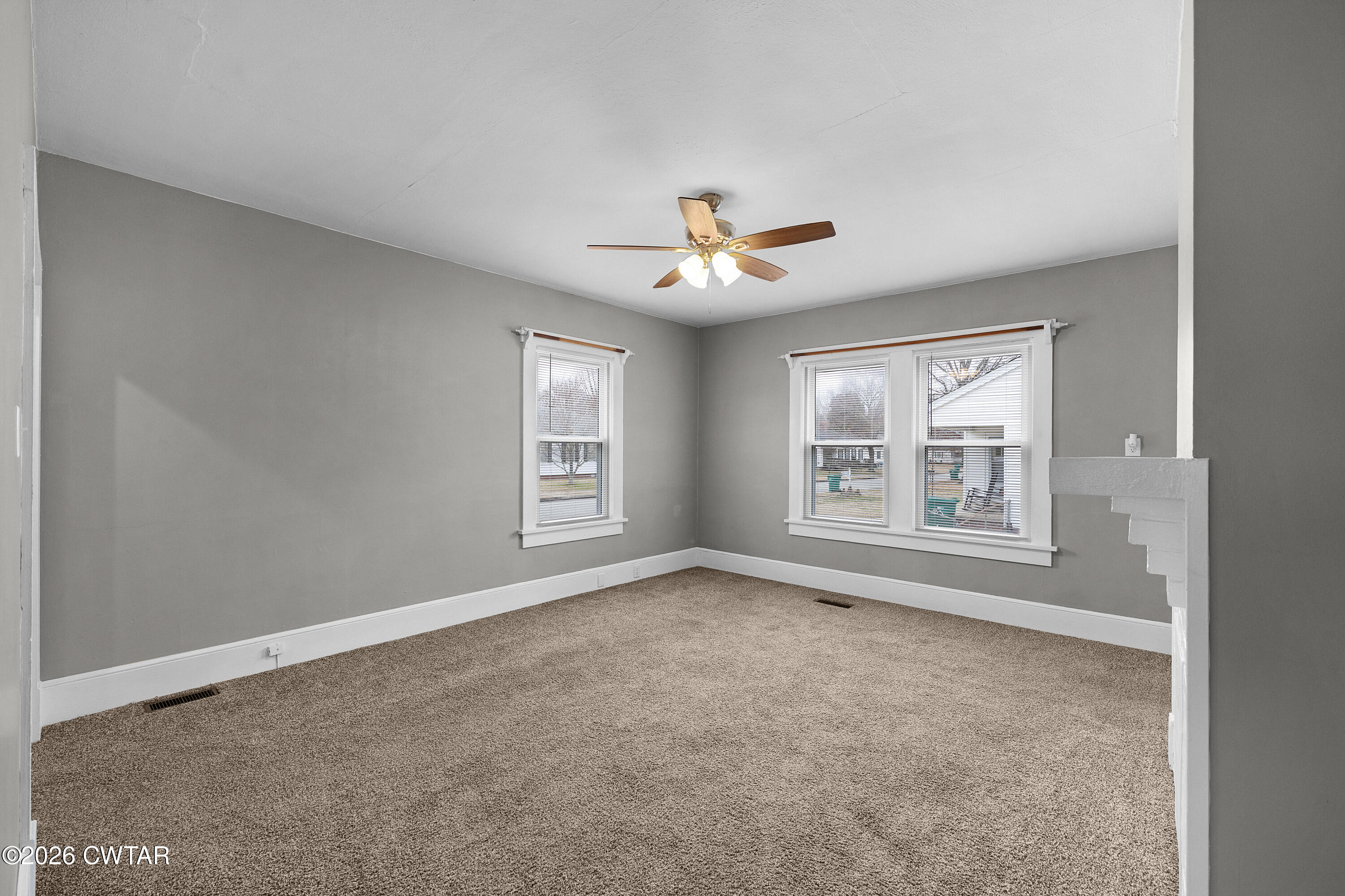 2 Gregg Street Jackson, TN 38301 - Photo 9 of 18 an empty room with windows and ceiling fan
