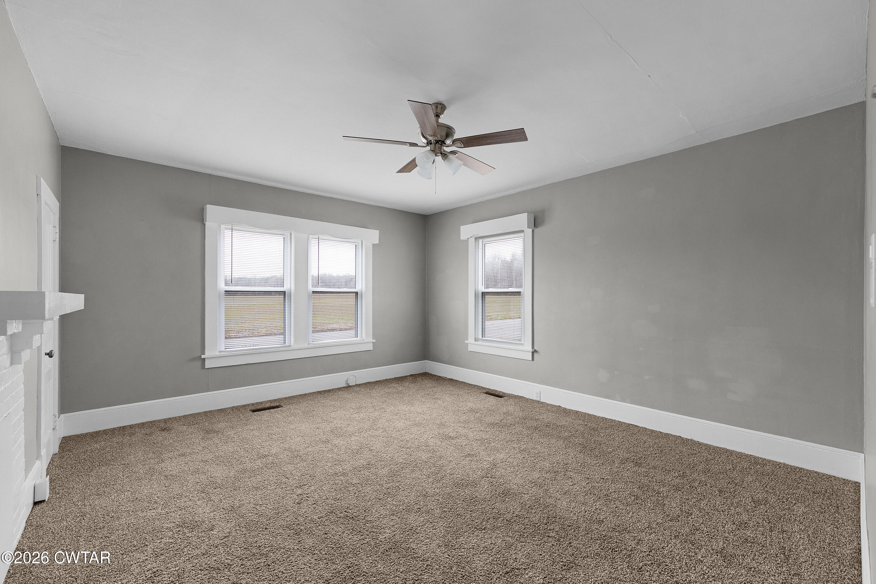 2 Gregg Street Jackson, TN 38301 - Photo 10 of 18 an empty room with chandelier fan and windows