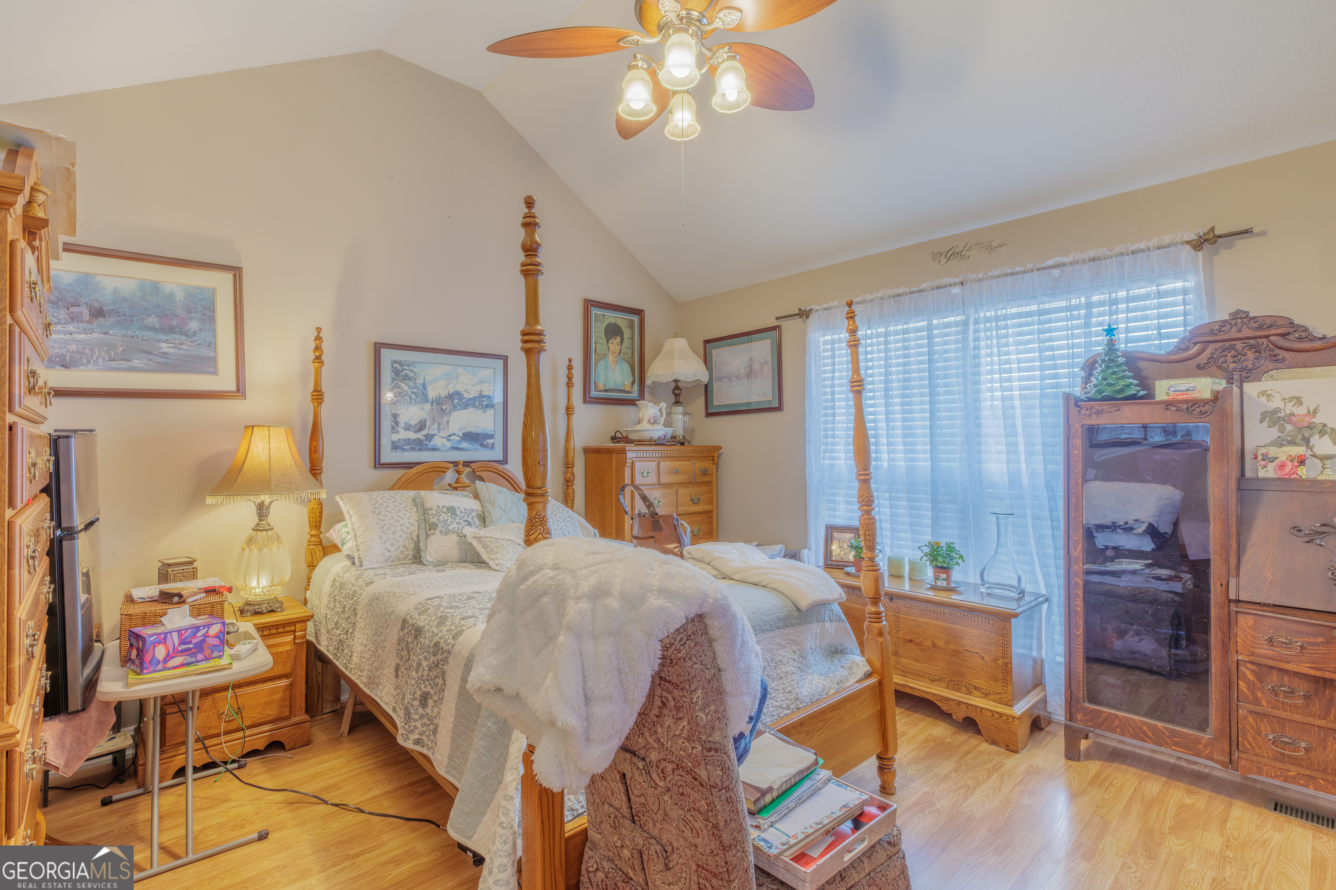 765 Greenbush Road LaFayette, GA 30728 - Photo 12 of 68 a bedroom with a bed and a chandelier