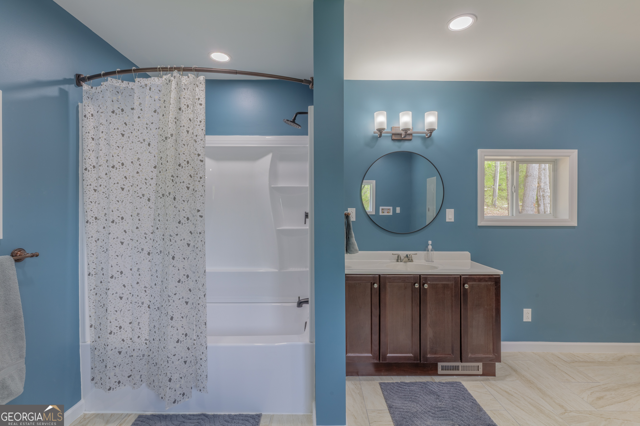 765 Greenbush Road LaFayette, GA 30728 - Photo 23 of 68 a bathroom with a sink a light fixture and a mirror