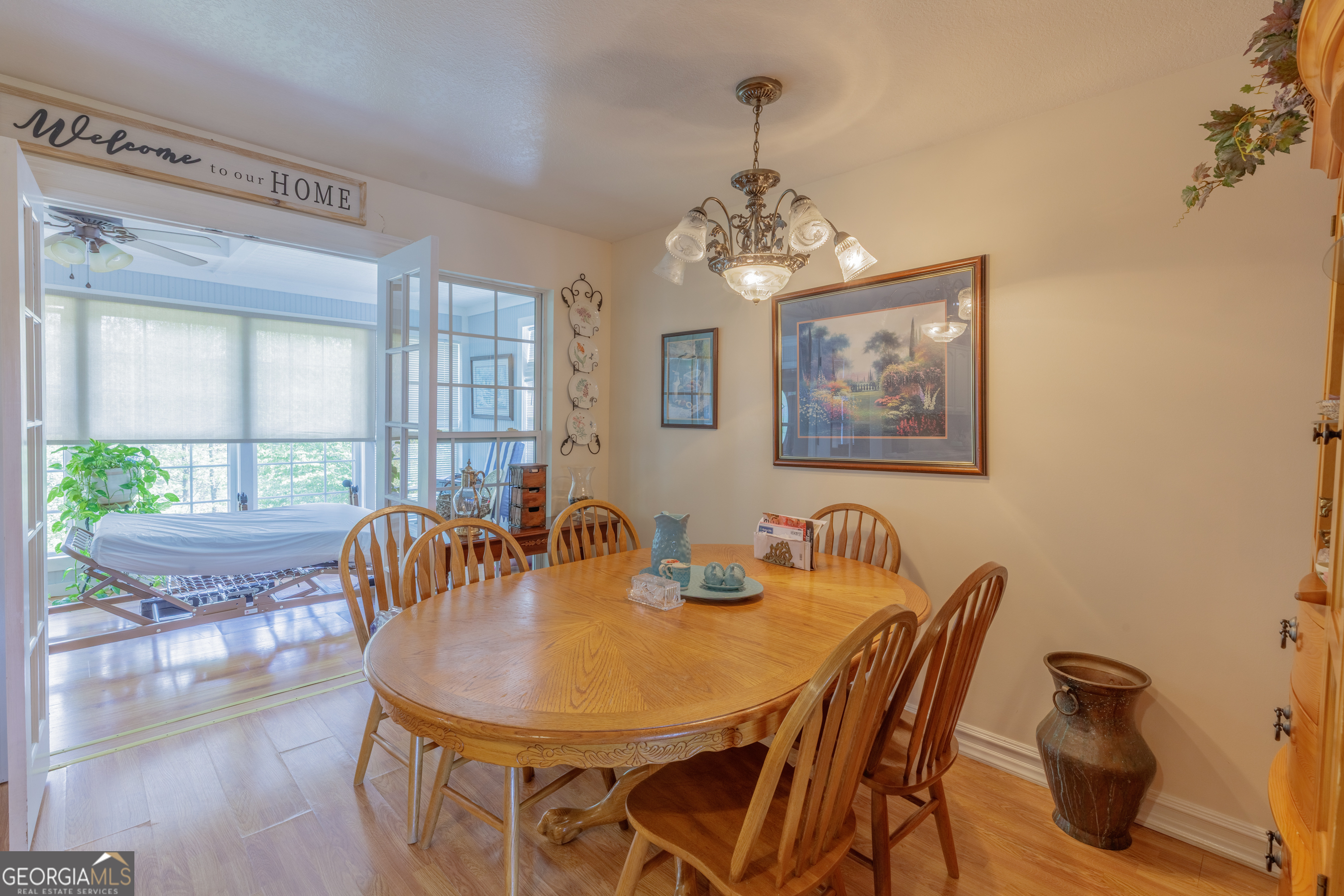 765 Greenbush Road LaFayette, GA 30728 - Photo 46 of 68 a view of a dining room with furniture wooden floor and chandelier