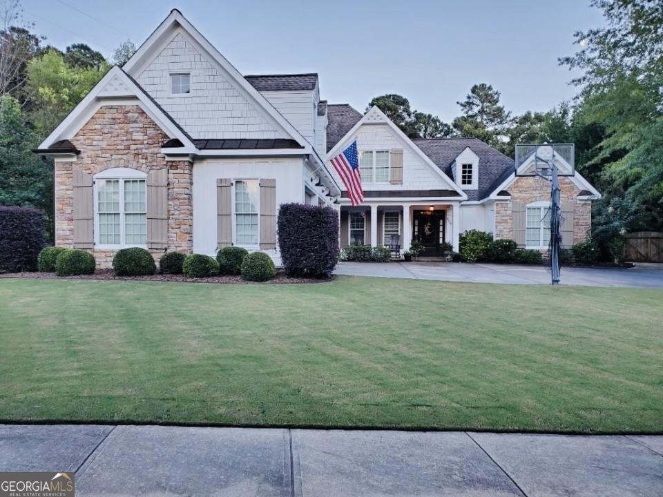624 Blackwater Ridge Canton, GA 30114 - Photo 1 of 1 a front view of a house with a garden