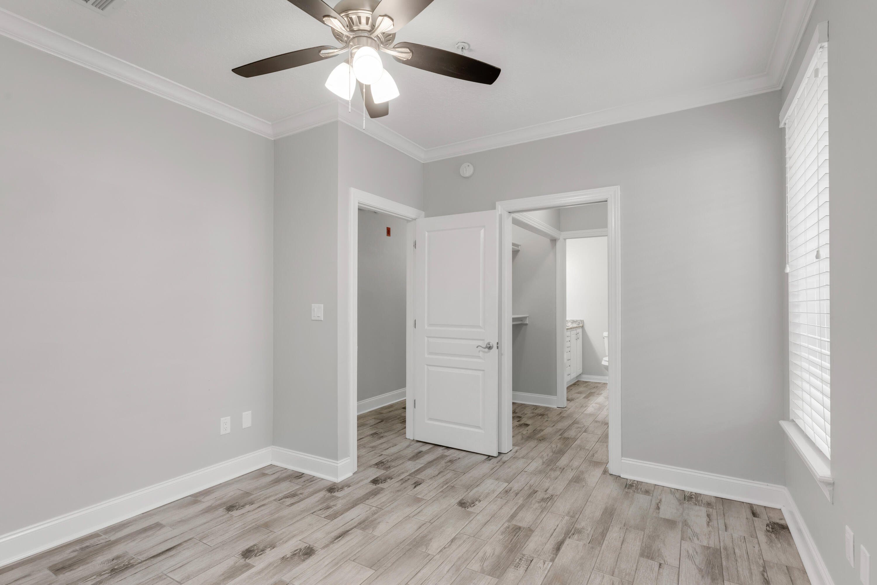 159 Brooks Street Southeast, Unit 207 Fort Walton Beach, FL 32548 - Photo 11 of 30 wooden floor in an empty room with a window