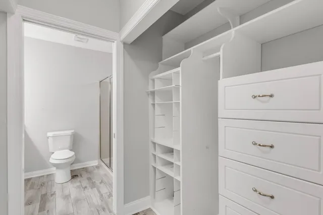 a bathroom with a toilet a sink and vanity