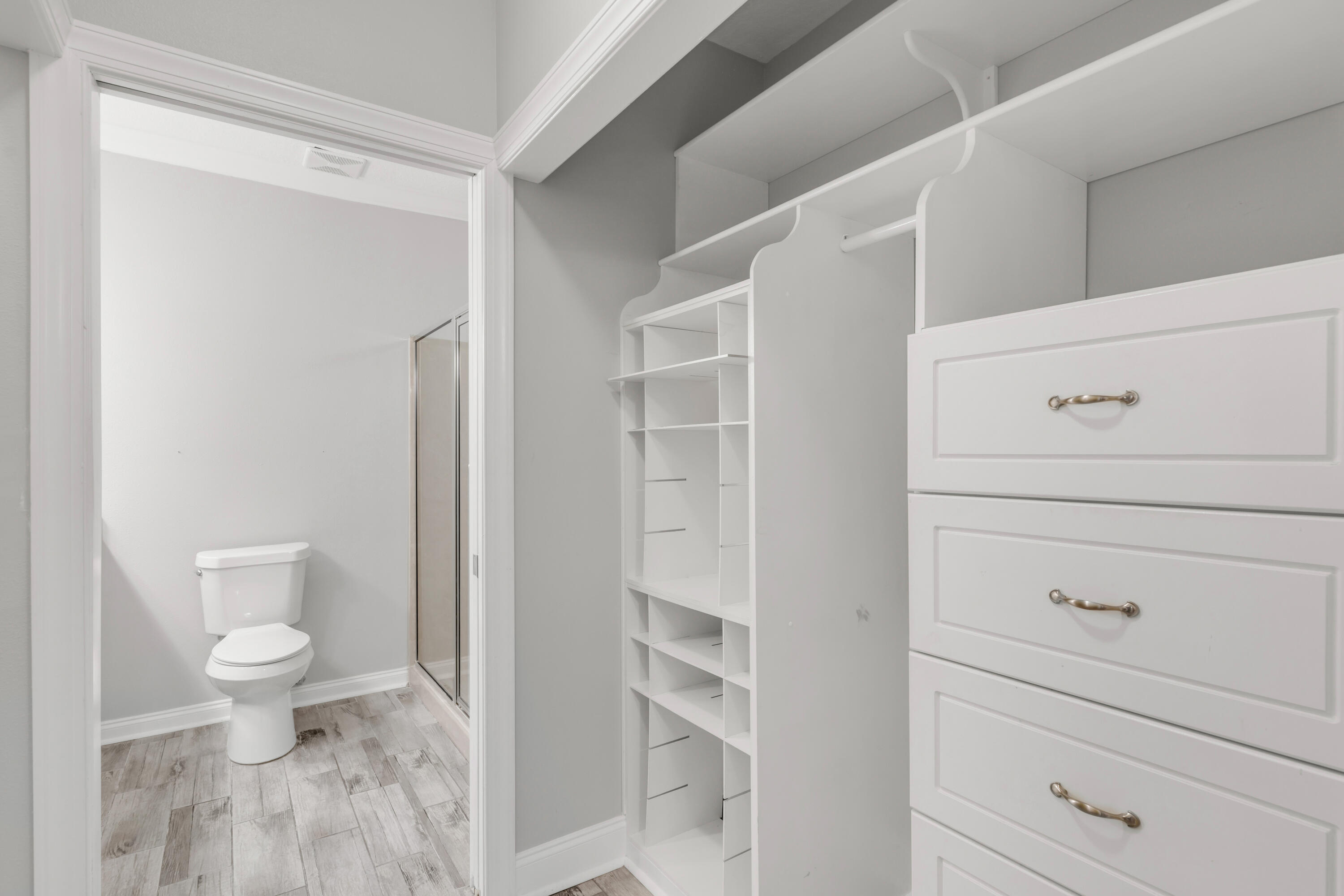 159 Brooks Street Southeast, Unit 207 Fort Walton Beach, FL 32548 - Photo 13 of 30 a bathroom with a toilet a sink and vanity