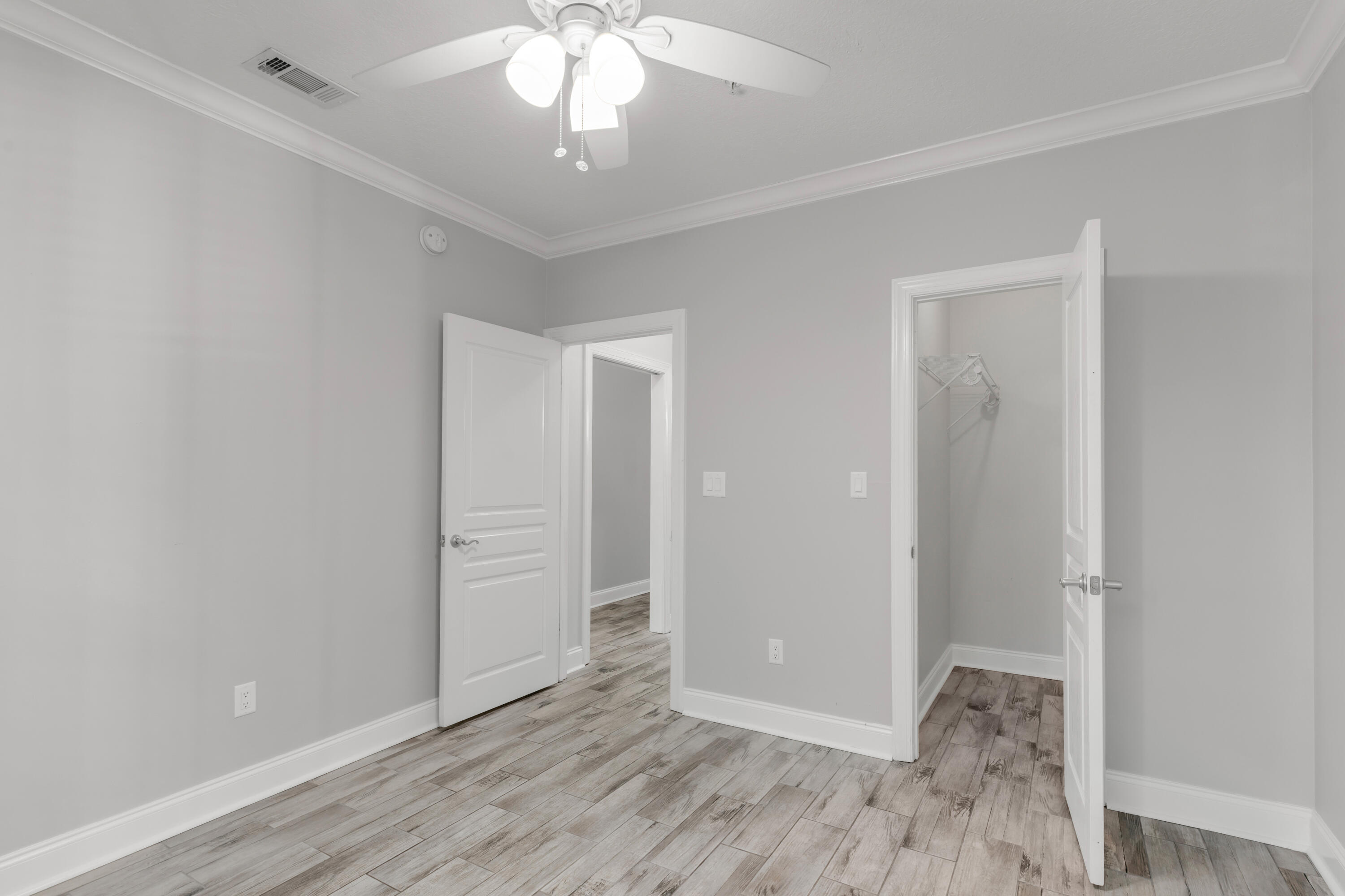 159 Brooks Street Southeast, Unit 207 Fort Walton Beach, FL 32548 - Photo 15 of 30 wooden floor in an empty room with a window