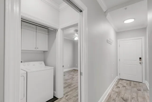 a view of storage and utility room with closet