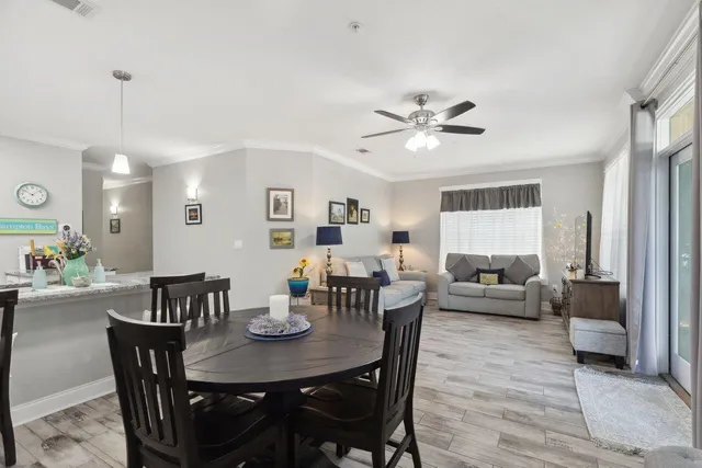 a view of a dining room with furniture and wooden floor