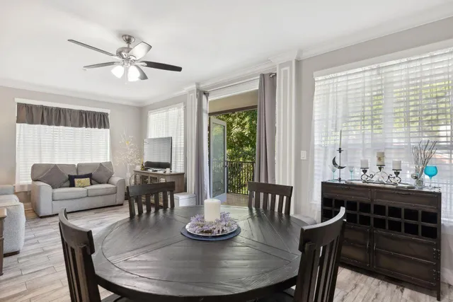 a view of a dining room with furniture window and wooden floor