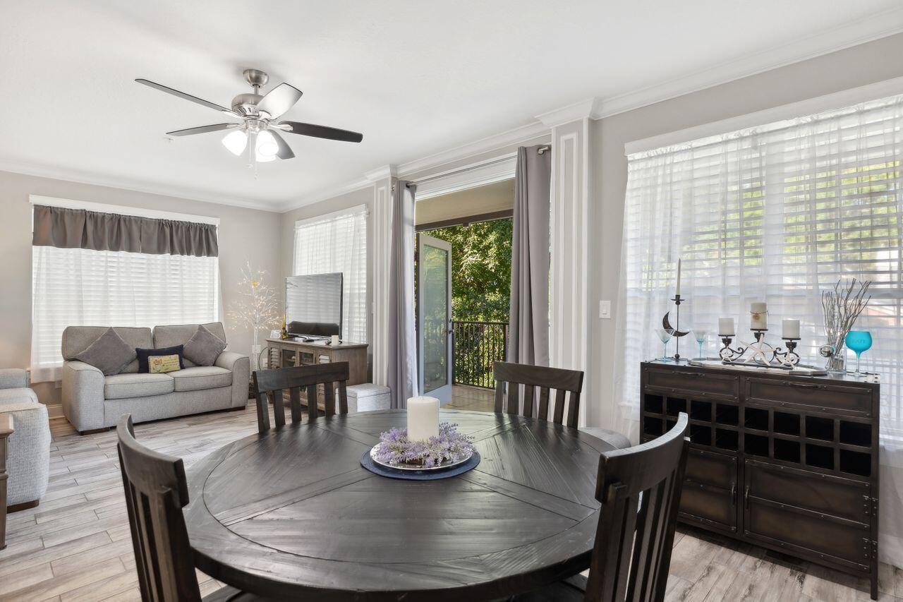 159 Brooks Street Southeast, Unit 207 Fort Walton Beach, FL 32548 - Photo 5 of 30 a view of a dining room with furniture window and wooden floor