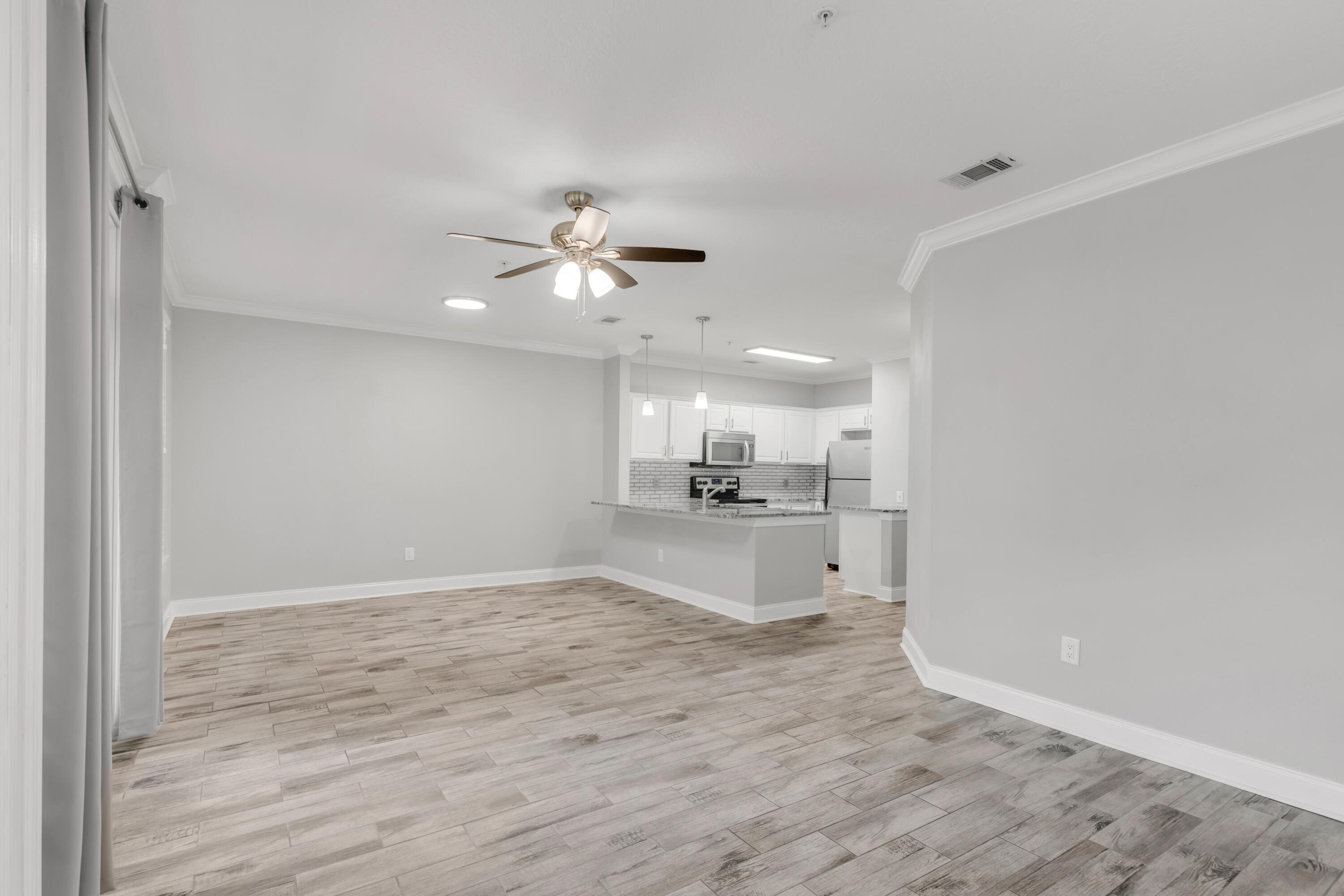 159 Brooks Street Southeast, Unit 207 Fort Walton Beach, FL 32548 - Photo 8 of 30 a view of a kitchen with a sink dishwasher a refrigerator and a stove
