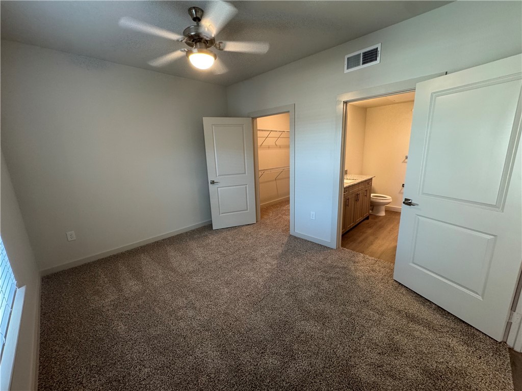6000 Jones Road, Unit 4211 Bryan, TX 77807 - Photo 15 of 19 a view of a livingroom with a ceiling fan and window