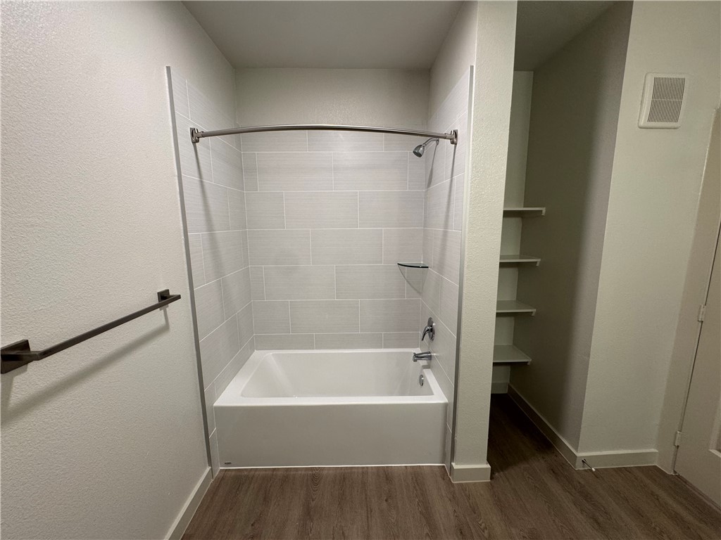 6000 Jones Road, Unit 4211 Bryan, TX 77807 - Photo 14 of 19 a bathroom with a bathtub and a shower