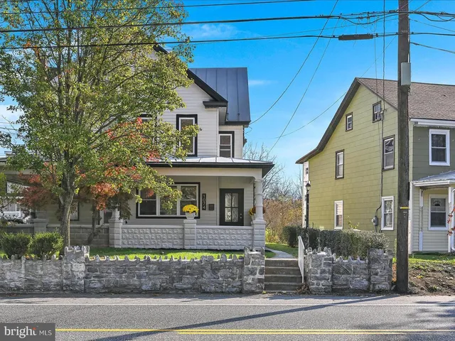 a view of a backyard with a garden and plants