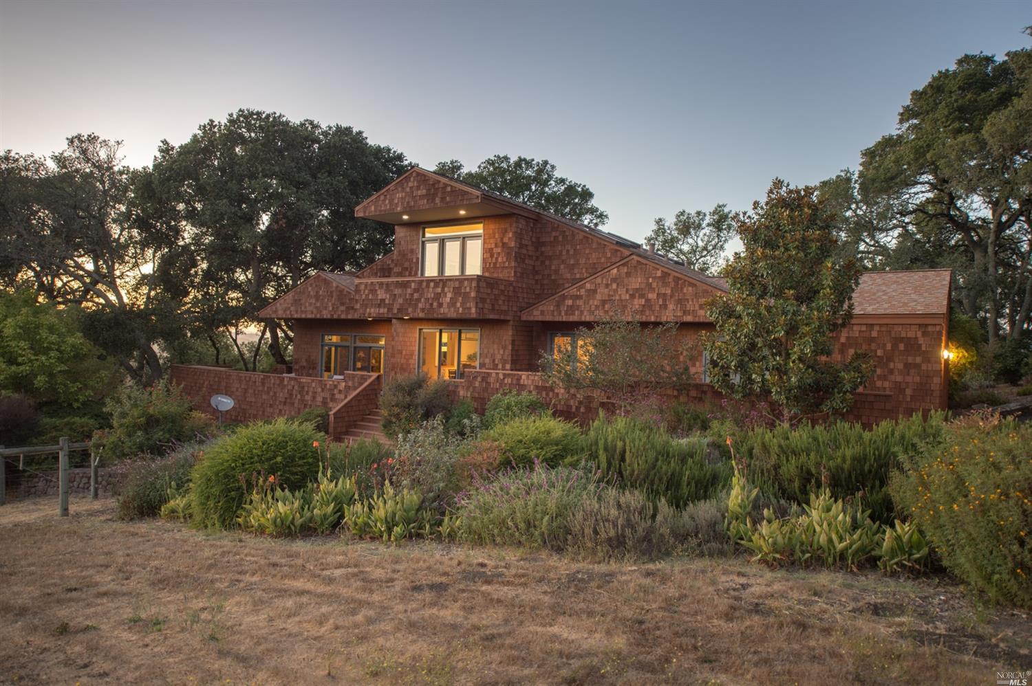 5155 Burnham Ranch Road Santa Rosa, CA 95404 - Photo 1 of 1 a front view of a house with a yard and garage