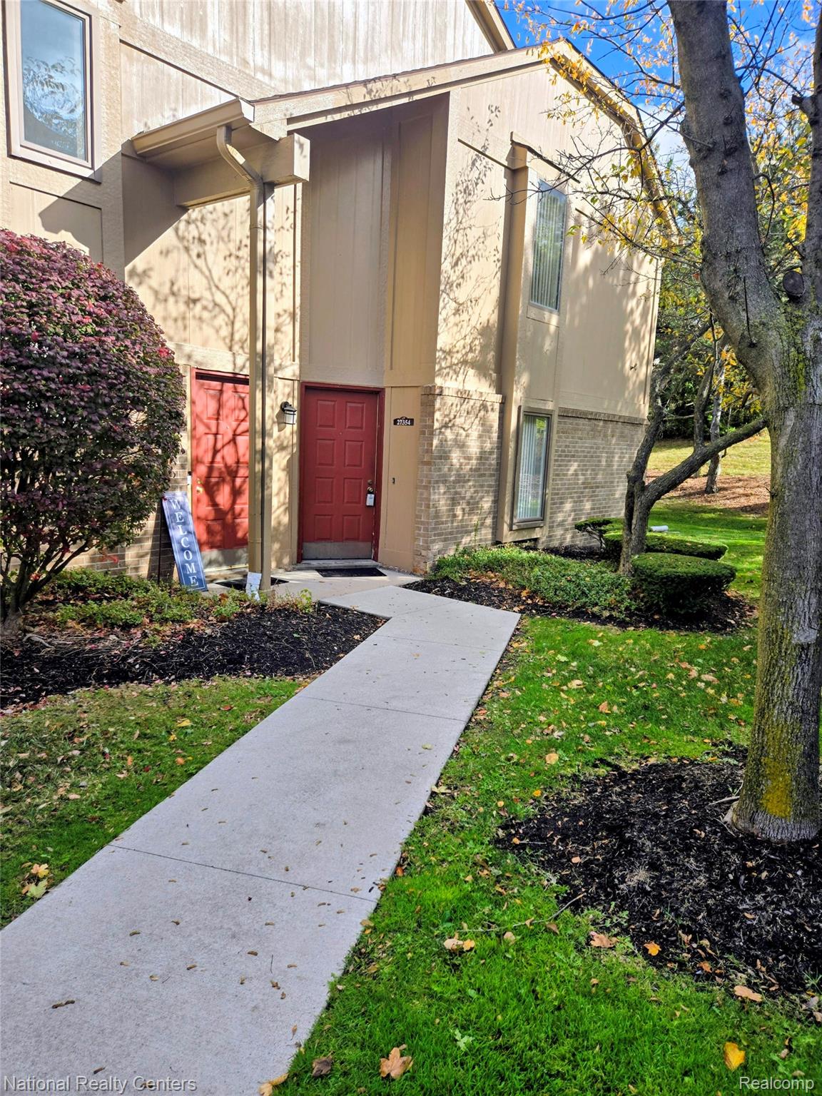 27354 Evergreen Road Southfield, MI 48076 - Photo 1 of 13 Property entrance featuring brick siding and a lawn