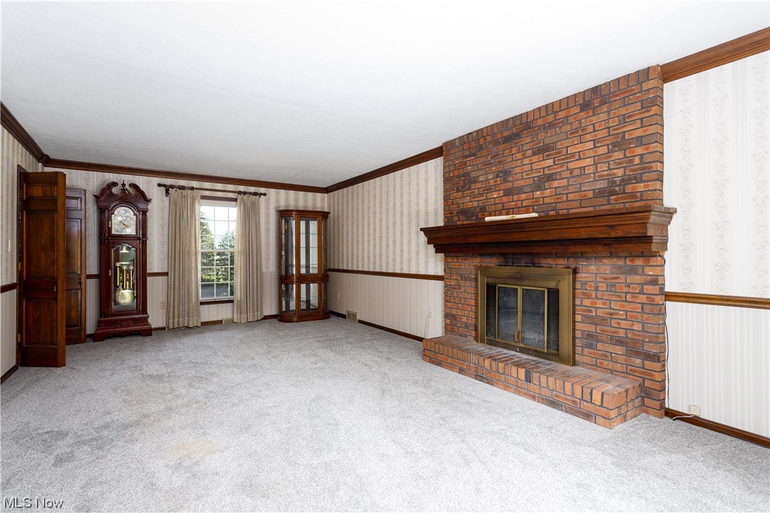 3177 Pickle Road Akron, OH 44312 - Photo 13 of 32 Large living room with brick fireplace