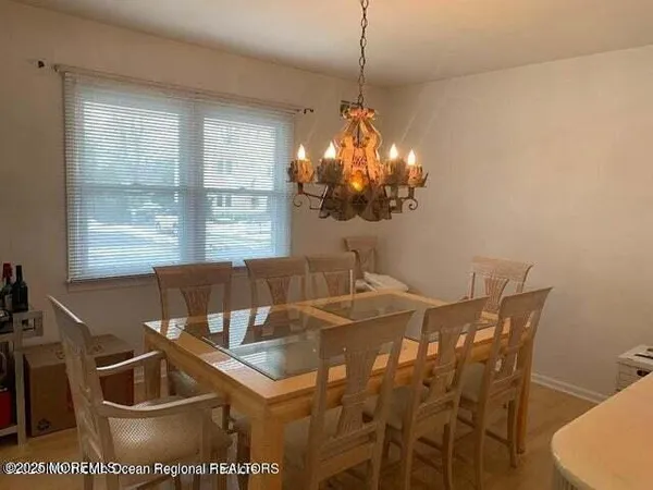 a view of a dining room and a chandelier
