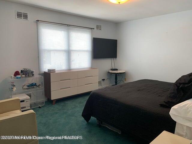 503 Wildwood Road West Allenhurst, NJ 07711 - Photo 8 of 12 a bedroom with a bed tv and window