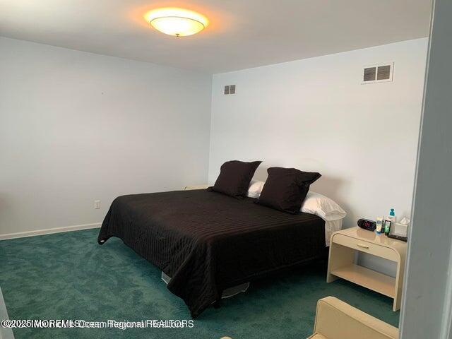 503 Wildwood Road West Allenhurst, NJ 07711 - Photo 9 of 12 a bedroom with a bed and a chair