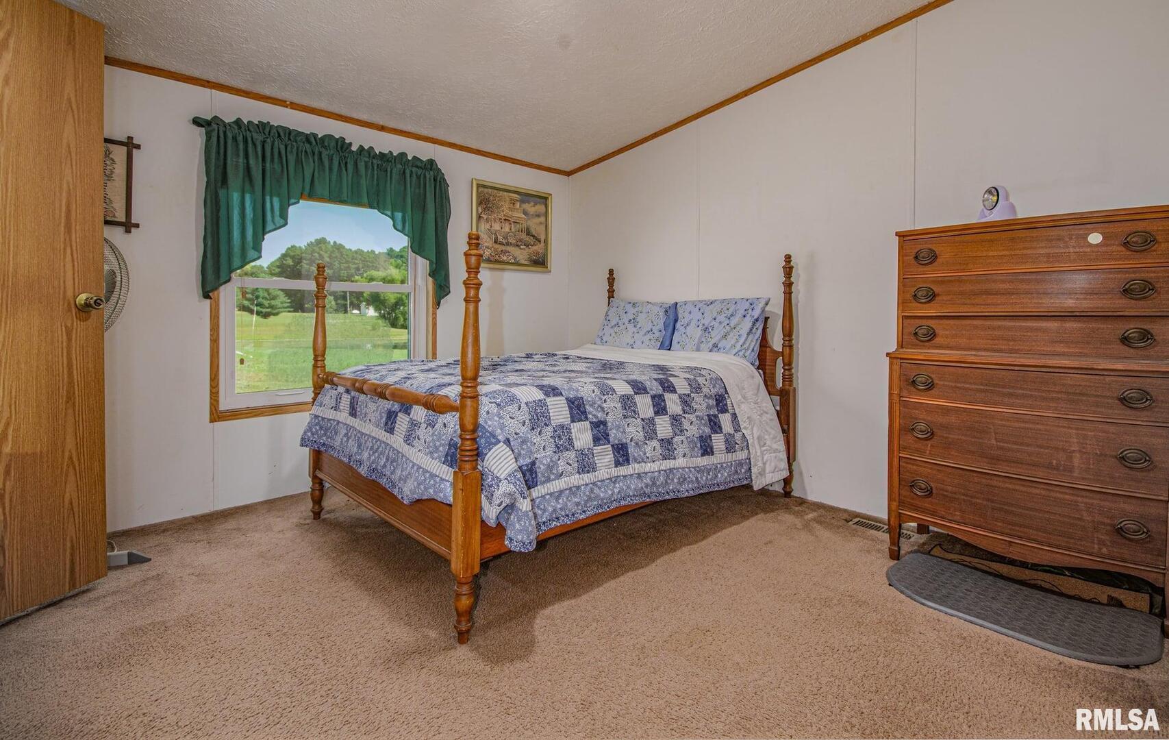 16807 East Kendall Road Mount Vernon, IL 62864 - Photo 15 of 28 a bedroom with a bed and a window
