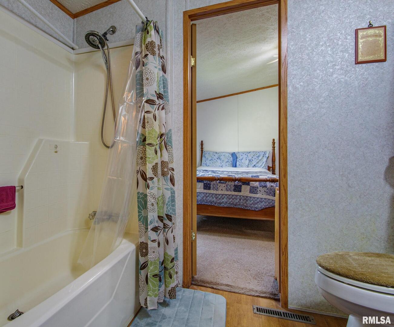 16807 East Kendall Road Mount Vernon, IL 62864 - Photo 16 of 28 a bathroom with a tub shower and sink