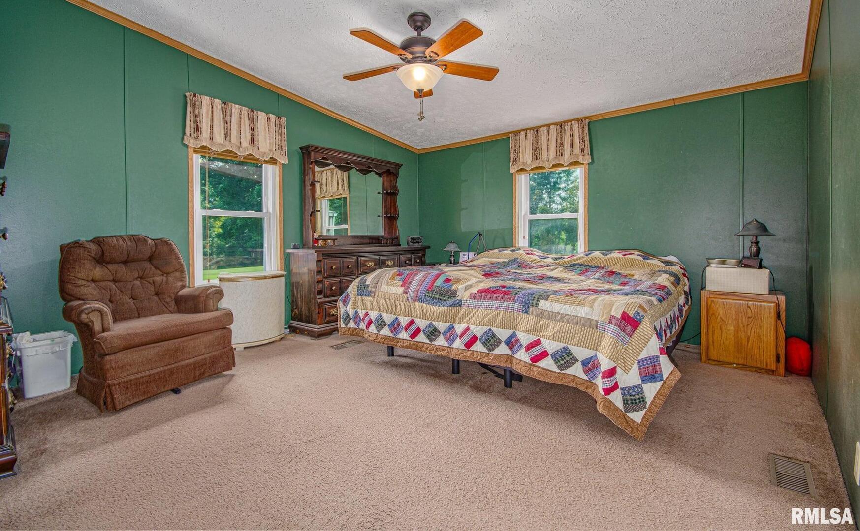 16807 East Kendall Road Mount Vernon, IL 62864 - Photo 10 of 28 a bedroom with a bed couch and window