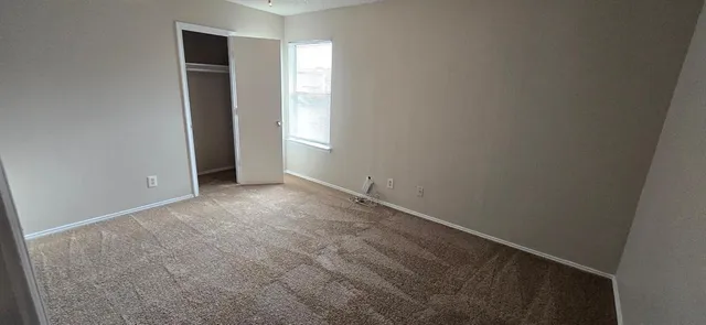 a view of an empty room and window