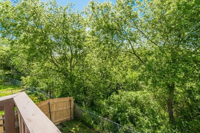 a backyard of a house with lots of green space