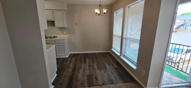 a view of wooden floor and staircase in a room
