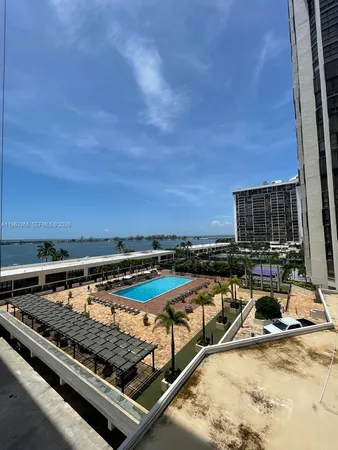 a view of a swimming pool with a lounge chair