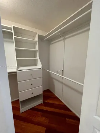 a view of an empty walk in closet