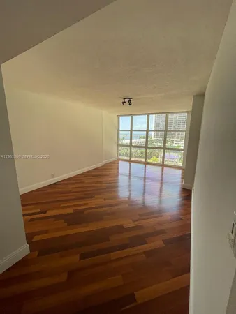 a view of an empty room and window