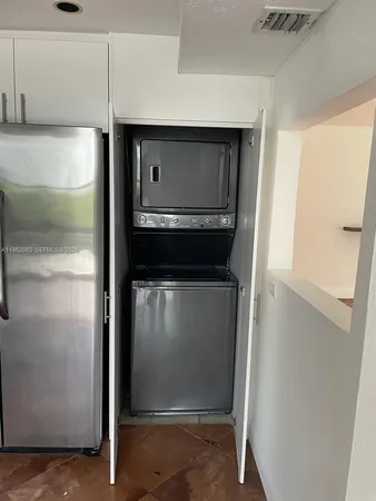 a utility room with washer and dryer