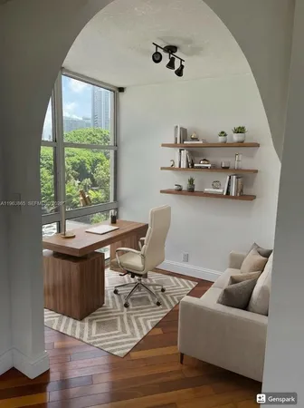 a living room with furniture a window and a table