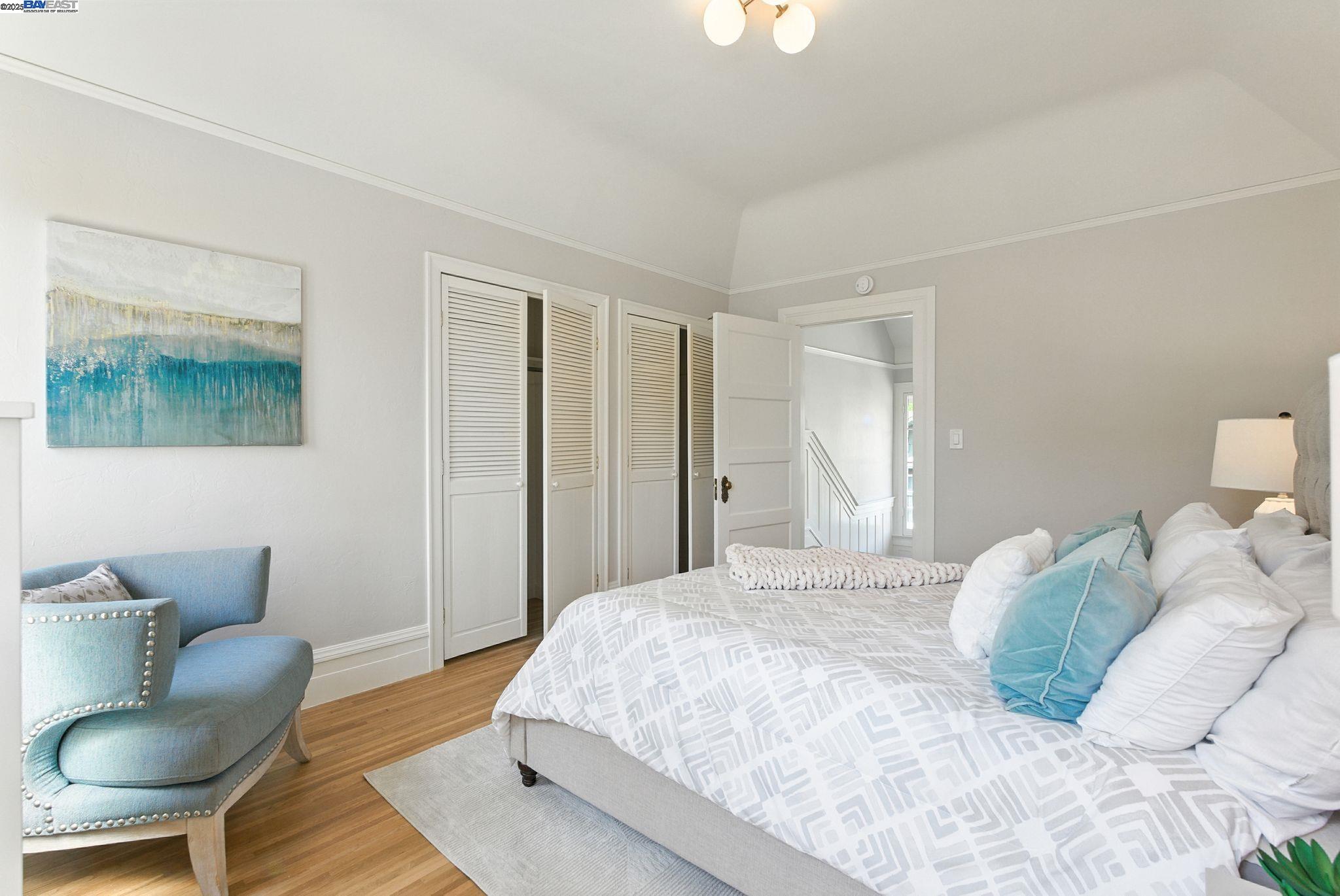 1247 Sherman Street Alameda, CA 94501 - Photo 22 of 50 a bedroom with a bed and chair