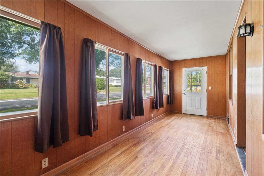 718 Mercer Road Beaver Falls, PA 15010 - Photo 12 of 44 a view of wooden floor and windows in a room
