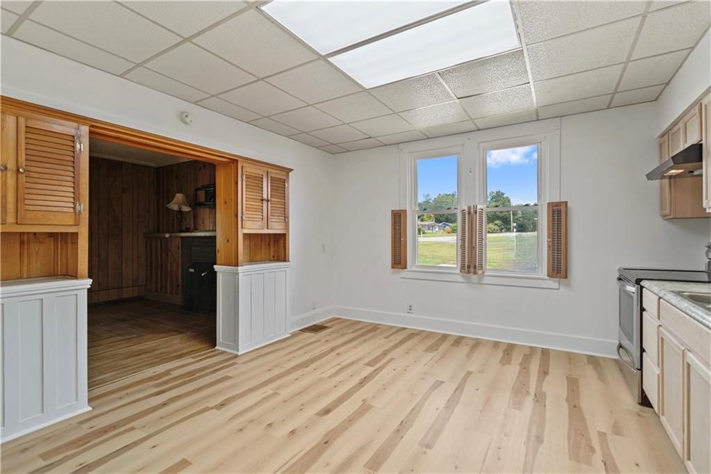 718 Mercer Road Beaver Falls, PA 15010 - Photo 16 of 44 a view of an empty room with window and wooden floor