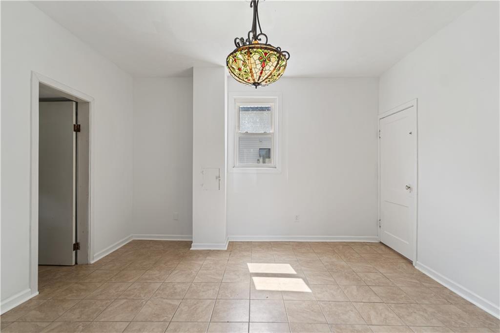 718 Mercer Road Beaver Falls, PA 15010 - Photo 18 of 44 a view interior of a house with wooden floor and a window