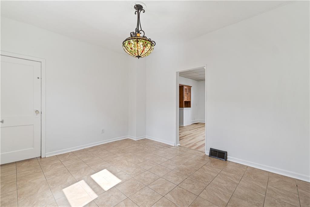 718 Mercer Road Beaver Falls, PA 15010 - Photo 20 of 44 a view of an empty room and a window